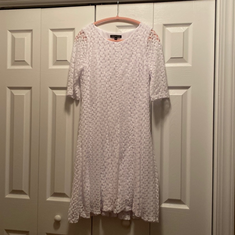 Women’s white lace knee length dress. Very good condition. Smoke/pet free home.